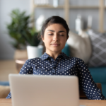 girl at computer with eyes closed